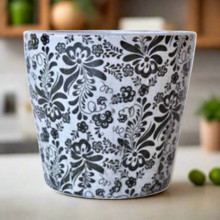 Black Round Floral Planter 14X16cm: A Stunning Decorative Piece
Add a pop of color and elegance to your home with our expertly crafted Black Round Floral Planter 14X16cm. This unique piece is sure to elevate your interior design. Unique Boys.