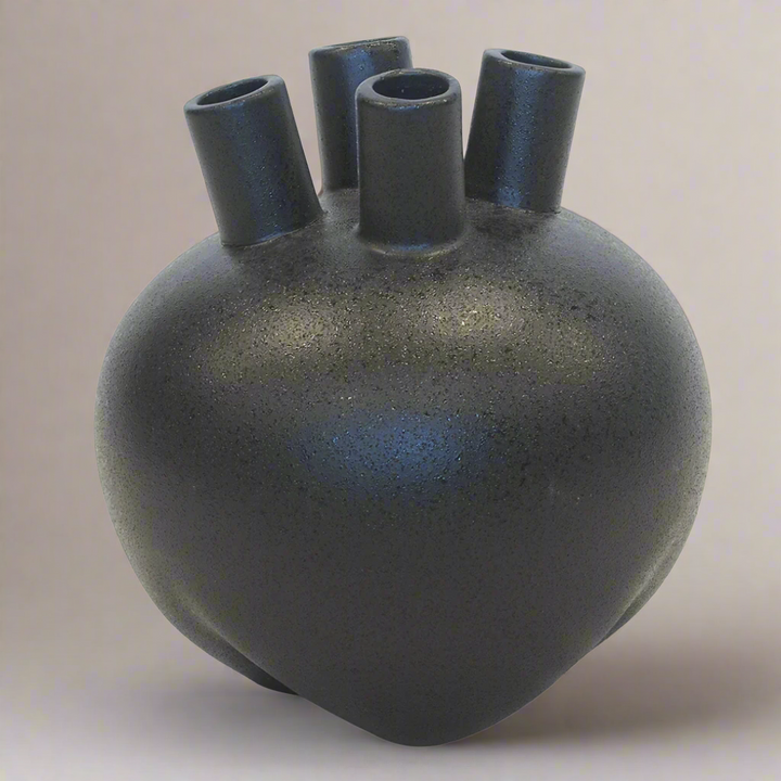 Ceramic Eyo Vase Black (20cm x 22cm)
Elevate your home decor with this stunning ceramic Eyo vase in sleek black. Expertly crafted, its modern design adds sophistication and style to any room.
Product Details:
Size: 20cm (H) x 22cm (D) (7.9 inches x 8.7 inches)
Material: High-quality ceramic
Color: Glossy black
Design: Unique Eyo-inspired shape with smooth finish
Features:
Sleek, modern design complements any decor style
Perfect size for showcasing small flower arrangements or greenery