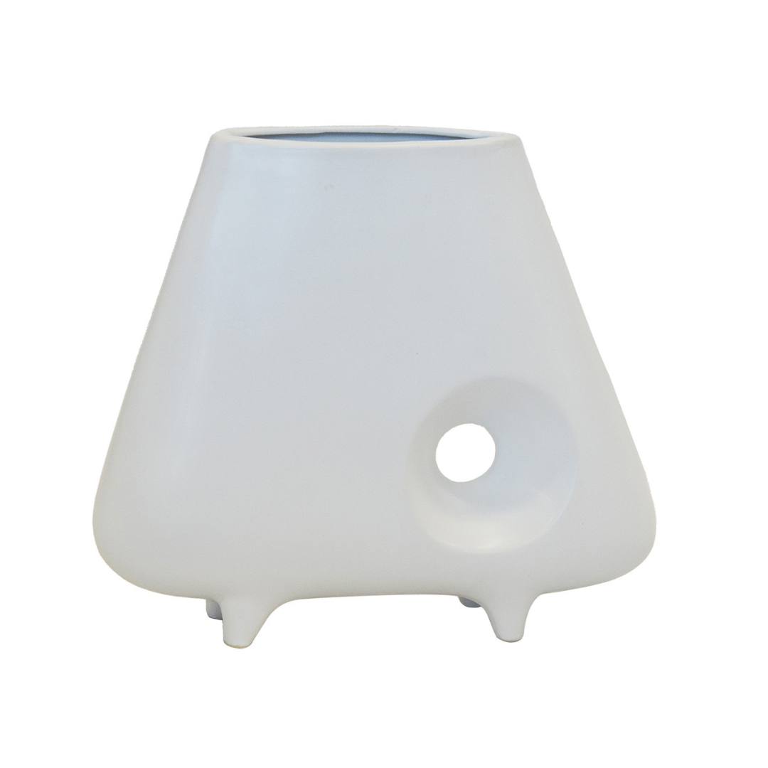 CERAMIC HOLE VASE WHITE (28CM (H) X 32CM) Add an elegant touch to any room with our Ceramic Hole Vase. Measuring 28cm in height and 32cm in diameter, this white vase features a unique hole design that adds visual interest to your home decor. Made from high-quality ceramic, it is durable and versatile for use with a variety of floral arrangements. Elevate your interior design with this stunning vase. Unique Boys