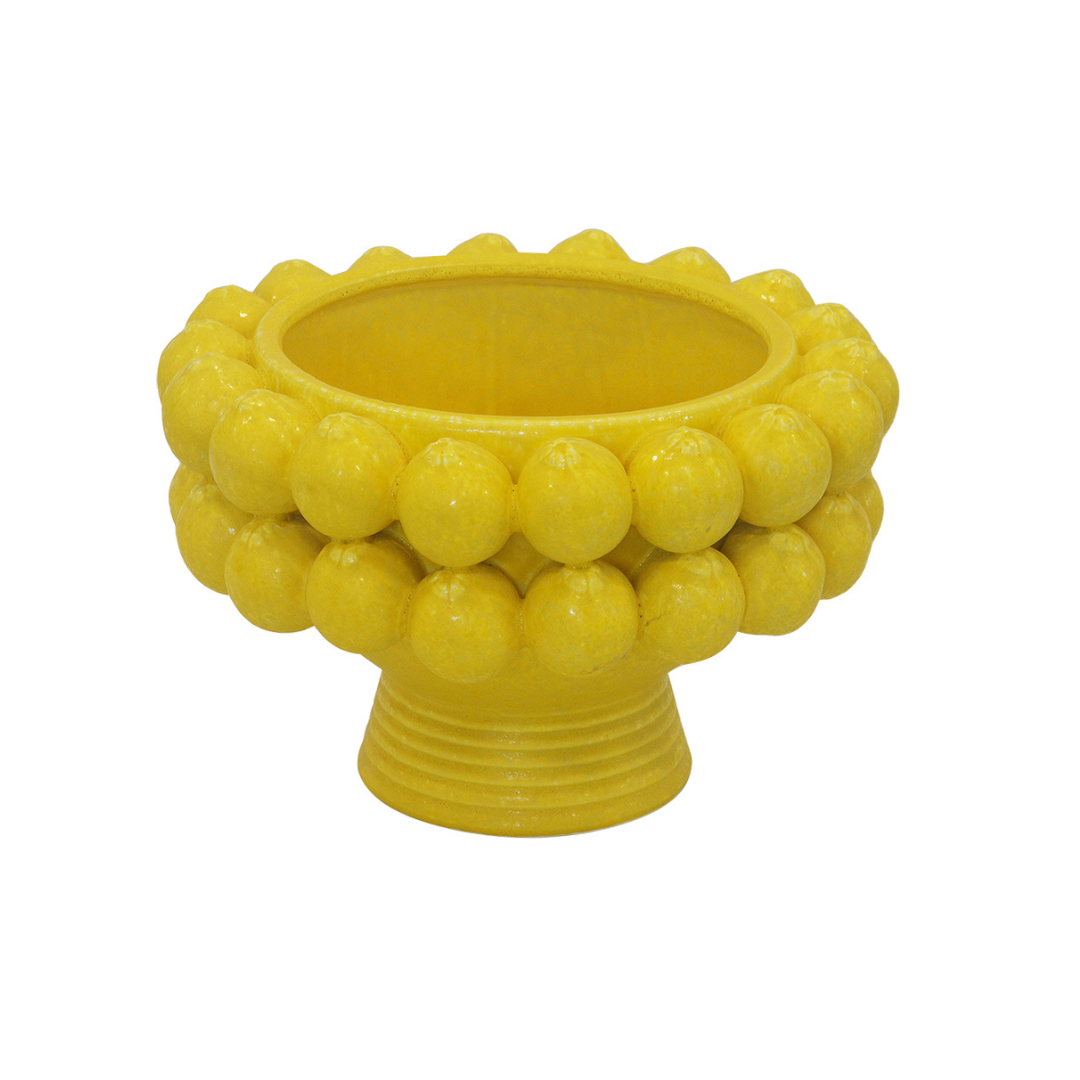 Elevate your serving experience with our Ceramic Lemon Pedestal Bowl. Standing at 24cm tall and 36cm in diameter, this bright yellow bowl adds a pop of color to any table setting. The perfect size for holding fruits or displaying desserts, it's both functional and stylish-Unique Boys