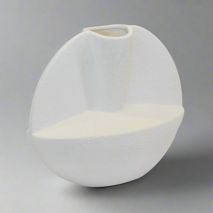 Ceramic Arhaus Wing Vase - White
Elevate your interior space with the stunning Ceramic Arhaus Wing Vase, expertly crafted from high-quality porcelain ceramic.
Design Features:
Size: 38cm (Height) x 33cm (Width)
Unique wing design adds a touch of elegance and sophistication
Sleek white finish complements modern and classic interior styles
Durable and timeless porcelain construction
Interior Style:
Complements modern, classic, and minimalist interior styles
Adds a touch of refinement and poise to living rooms