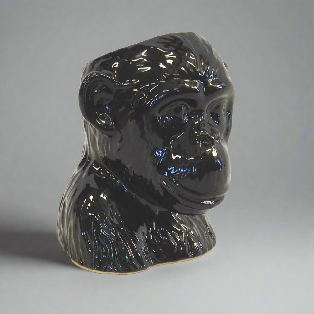 Ceramic Monkey Head Planter Pot - Black
Add a touch of whimsy and unique style to your interiors with the charming Ceramic Monkey Head Planter Pot, expertly crafted from high-quality ceramic porcelain.
Design Features:
Size: 16cm (Height) x 15cm (Diameter)
Intricately designed monkey head shape adds a playful touch
High-quality ceramic porcelain construction ensures durability and longevity
Perfect for displaying small plants, succulents, or decorative items
Interior Style:
Complements modern, bohemian,