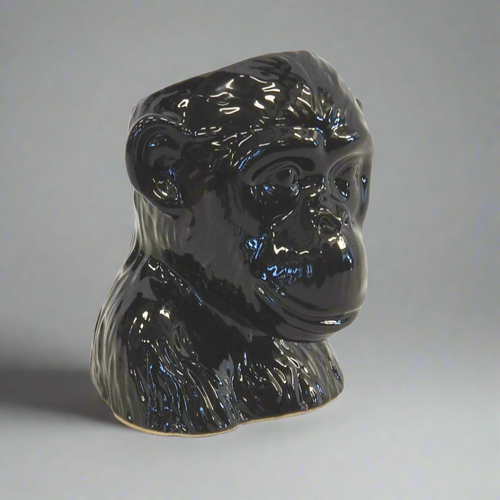 Ceramic Monkey Head Planter Pot - Black
Add a touch of whimsy and unique style to your interiors with the charming Ceramic Monkey Head Planter Pot, expertly crafted from high-quality ceramic porcelain.
Design Features:
Size: 16cm (Height) x 15cm (Diameter)
Intricately designed monkey head shape adds a playful touch
High-quality ceramic porcelain construction ensures durability and longevity
Perfect for displaying small plants, succulents, or decorative items
Interior Style:
Complements modern, bohemian,