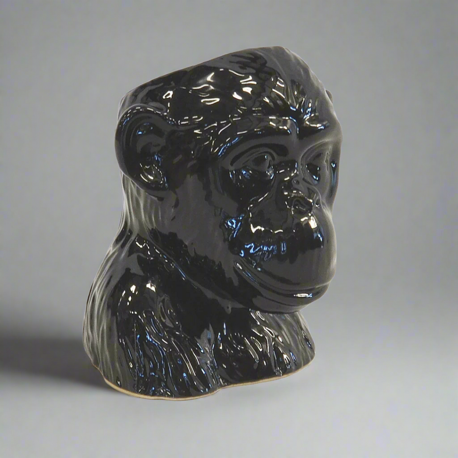 Ceramic Monkey Head Planter Pot - Black
Add a touch of whimsy and unique style to your interiors with the charming Ceramic Monkey Head Planter Pot, expertly crafted from high-quality ceramic porcelain.
Design Features:
Size: 16cm (Height) x 15cm (Diameter)
Intricately designed monkey head shape adds a playful touch
High-quality ceramic porcelain construction ensures durability and longevity
Perfect for displaying small plants, succulents, or decorative items
Interior Style:
Complements modern, bohemian,