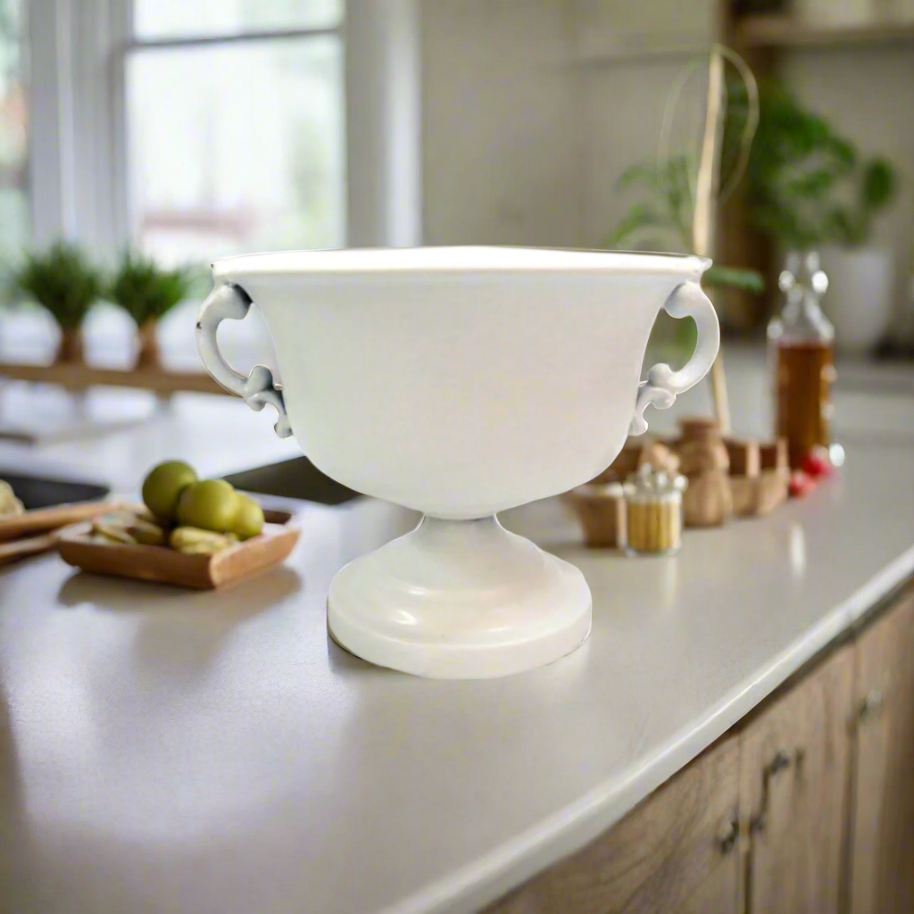 Elevate Your Decor with the Elegant County Jug
Add a touch of sophistication and glamour to any space with our exquisite County Jug. This stunning piece is crafted from high-quality metal with an antique goldish finish, giving it a luxurious and timeless appeal.
Versatile and Multifunctional
Our County Jug is not just a beautiful decorative piece, but also a versatile and practical addition to any home or event. Measuring 20cm x 16.5cmh, it can be used as a stunning vase, planter, or even as a unique award