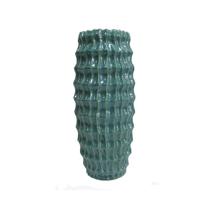 Elevate Your Space with the Stunning Diaspora Vase
Add a touch of elegance and sophistication to any room with the beautiful Diaspora vase. Crafted from high-quality ceramic, this stunning vase boasts a unique, intense teal color with a melted glass look that's sure to impress.
Expertly Crafted
The Diaspora vase is expertly glazed to ensure a long-lasting, beautiful finish. Its perfect size (14cm D x 32cmH) makes it ideal for showcasing long-stemmed greenery, branches, or flowers, adding a touch of natural