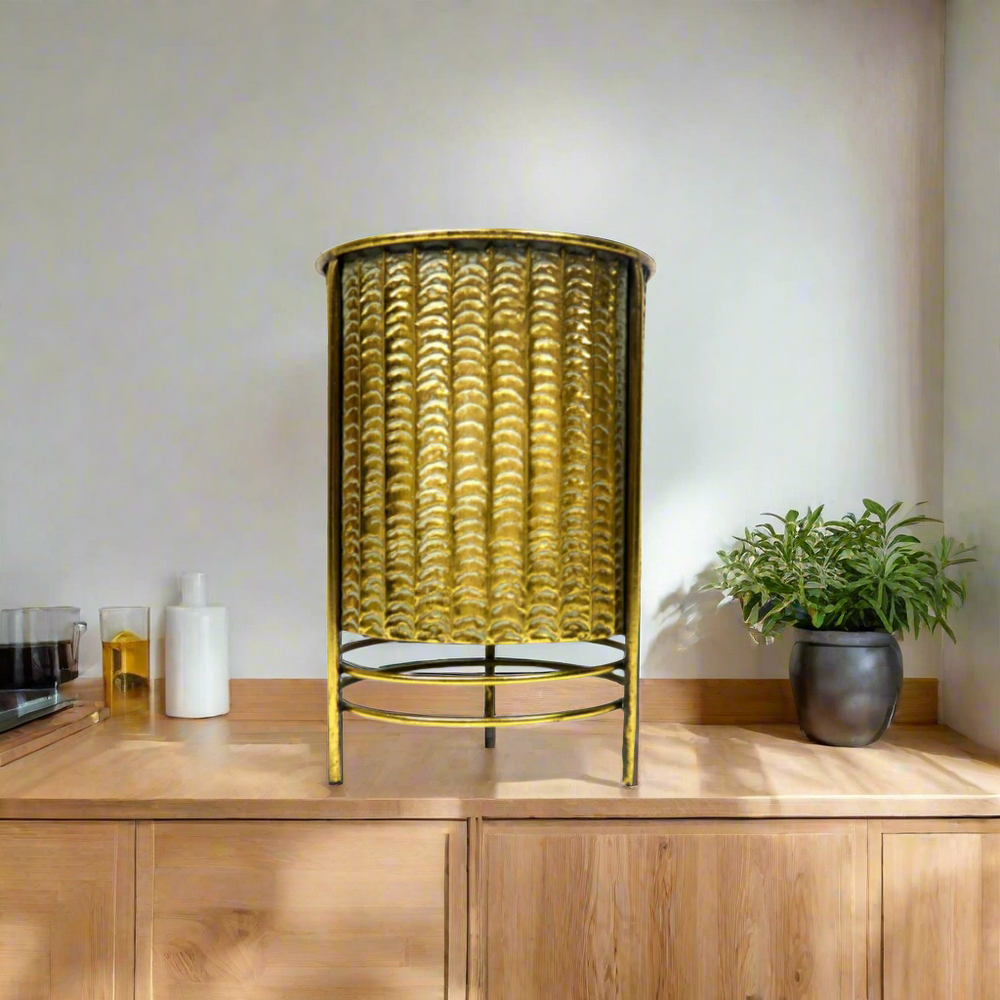 Ballister Pot - Antique Gold Elegance
Elevate your home decor with the stunning Ballister Pot, a one-of-a-kind antique gold container that adds style and functionality to any room. Its unique design features an attached metal surround with legs, lifting the pot off the surface for a striking display.