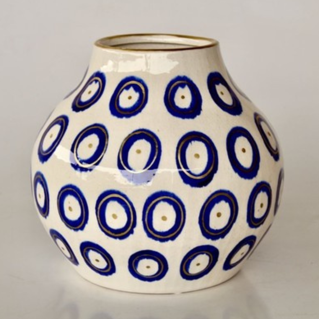 Medium Blue Circle Ceramic Vase Gold Trim 27X26cm
Elevate your home decor with our stunning  Medium Blue Circle Ceramic Vase Gold Trim 27X26cm. Handcrafted with precision and care, this unique vase features a beautiful design that adds a touch of elegance to any room. Its striking is sure to become a focal point in your space, and its size makes it perfect for showcasing your favorite flowers or branches. Unique Boys.