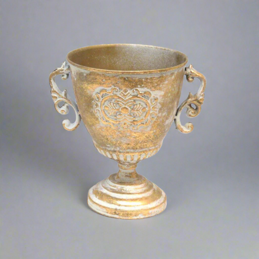 Add a Touch of Elegance with the Solo Pot
Elevate your home decor with the Solo Pot, a stunning multi-functional piece made of antique gold metal. This beautifully crafted pot is perfect for adding a touch of sophistication to any room.