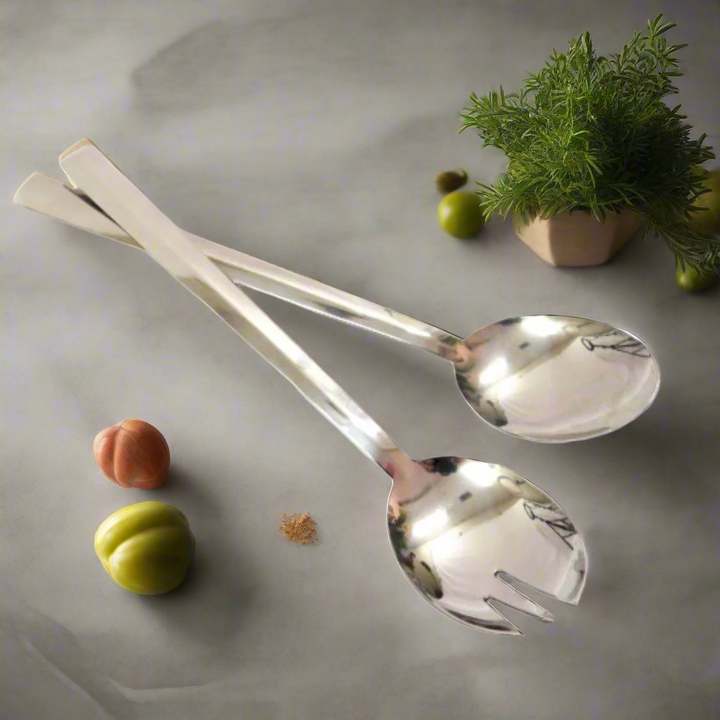 Elevate Your Dining Experience with Traderoutes Salad Servers
Add a touch of sophistication to your kitchen and dining table with these expertly crafted Traderoutes Salad Servers. Made from high-quality, sleek stainless steel, these servers are designed to provide a perfect balance of functionality and style.