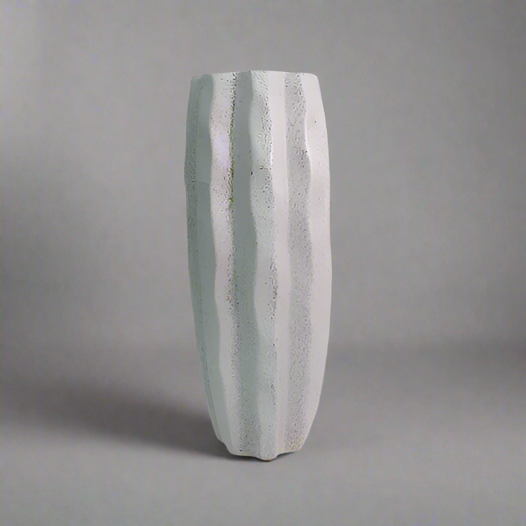 Product Details: Saga Vase
Description: A stunning and timeless Saga vase, crafted from charcoal stone speckle, perfect for displaying long-stemmed greenery and adding a touch of elegance to any room.
Material: Charcoal stone speckle