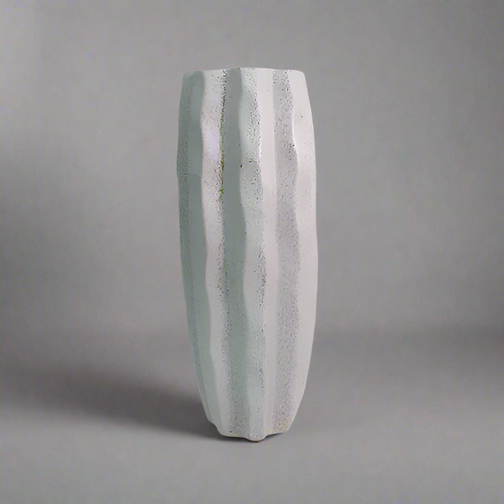 Product Details: Saga Vase
Description: A stunning and timeless Saga vase, crafted from charcoal stone speckle, perfect for displaying long-stemmed greenery and adding a touch of elegance to any room.
Material: Charcoal stone speckle