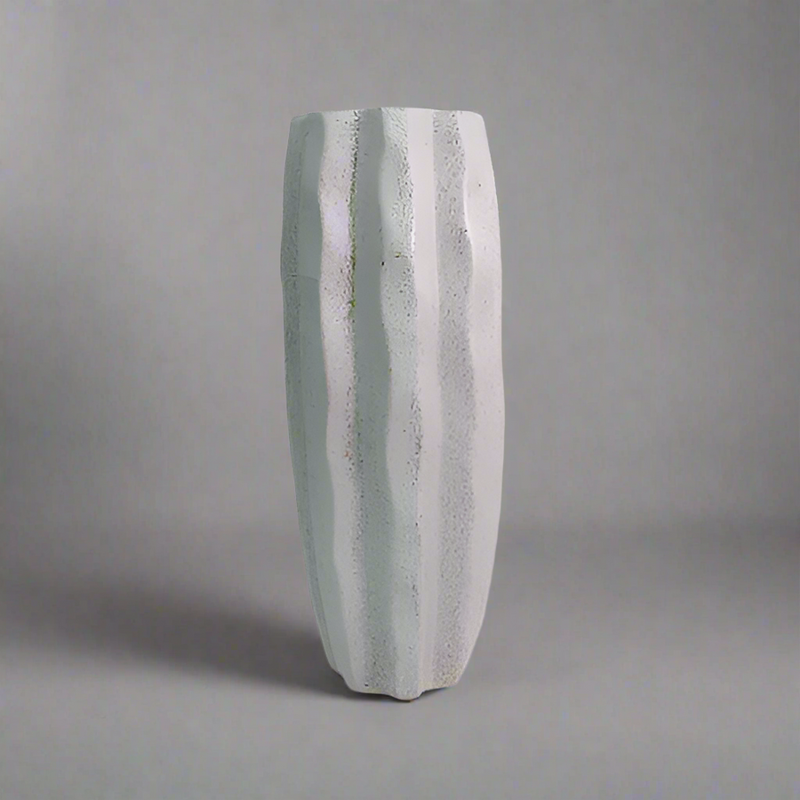 Product Details: Saga Vase
Description: A stunning and timeless Saga vase, crafted from charcoal stone speckle, perfect for displaying long-stemmed greenery and adding a touch of elegance to any room.
Material: Charcoal stone speckle