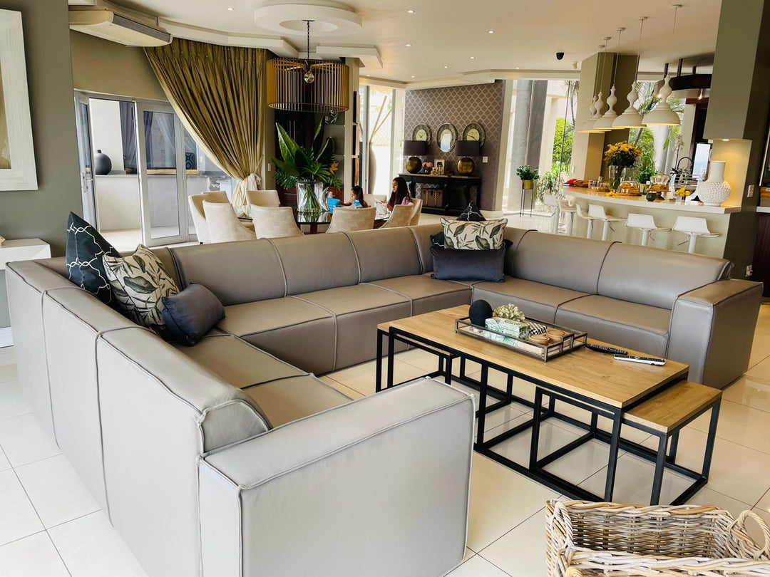 Large neutral corner sofa arranged in a contemporary living room