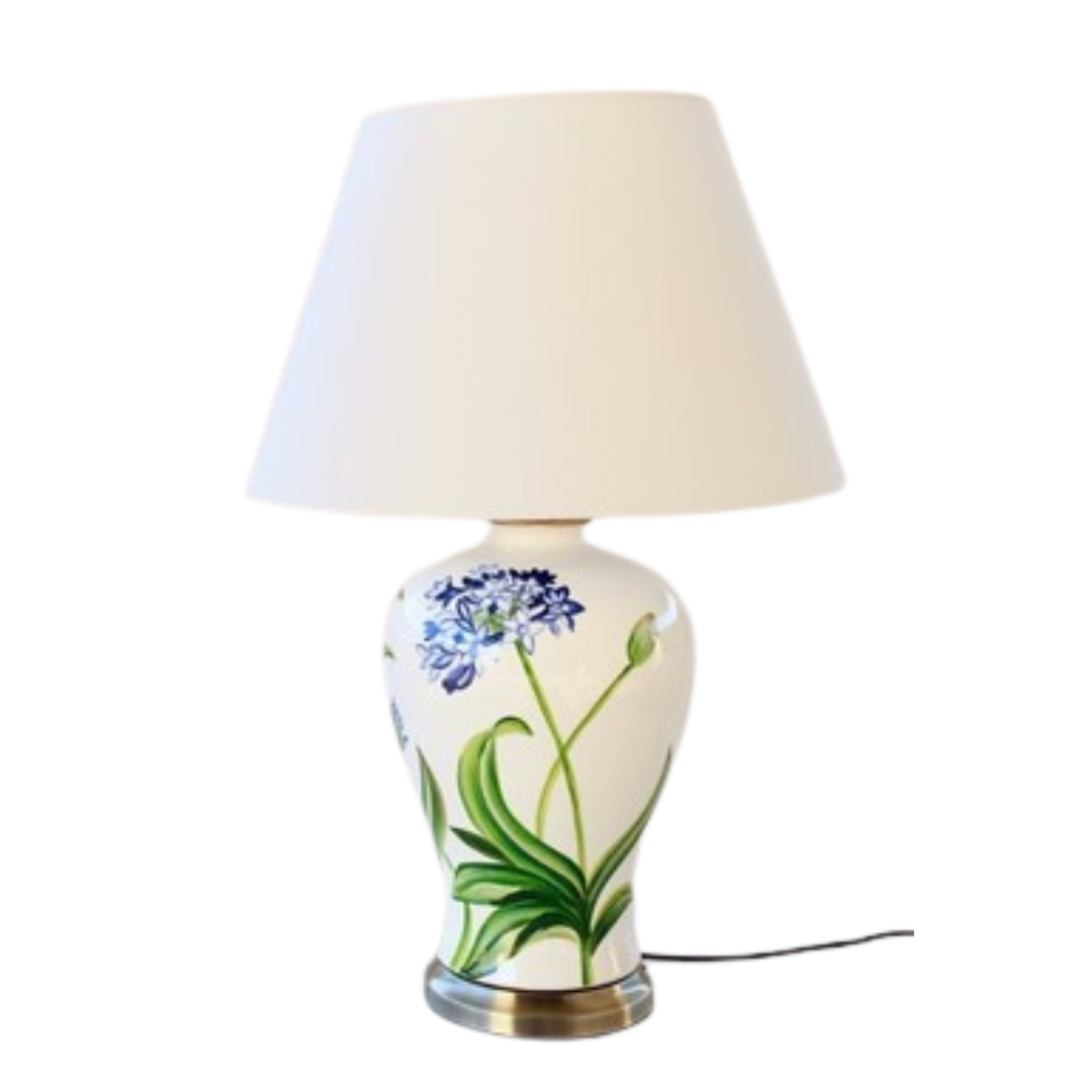 Agapanthus Lamp With White Shade 68X45cm
Add a touch of floral elegance to your space with our stunning Agapanthus Lamp With White Shade. This unique lamp features a beautiful agapanthus design paired with a crisp white shade, creating a fresh and sophisticated ambiance perfect for relaxing or entertaining. Measuring 68cm in height and 45cm in width, this lamp is perfectly sized for living rooms, bedrooms, or offices. Unique Boys.