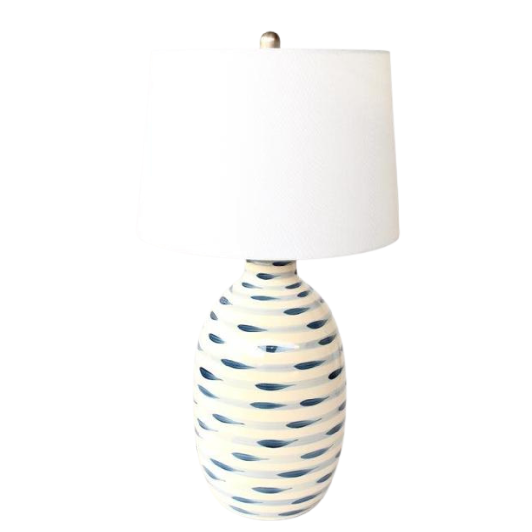 Elevate your home decor with this beautiful lamp base, featuring elegant stripes in blue and white. Topped with a white finial and harp shade, measuring 69x38cm, this lamp will add a touch of sophistication to any room. Light up your space with style and functionality. Unique Boys.