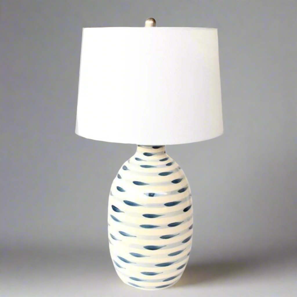 BLUE & WHITE STRIPES LAMP BASE WHITE FINIAL &amp; HARP SHADE 69X38CM.Elevate your home decor with our stunning Blue &amp; White Stripes Lamp Base, a masterpiece of classic design and functionality. This beautifully crafted lamp base features elegant stripes in soothing shades of blue and white, creating a timeless and sophisticated ambiance in any room.
The blue and white stripes are perfectly complemented by the crisp white finial and harp shade, adding a touch of refinement and elegance to your space. 