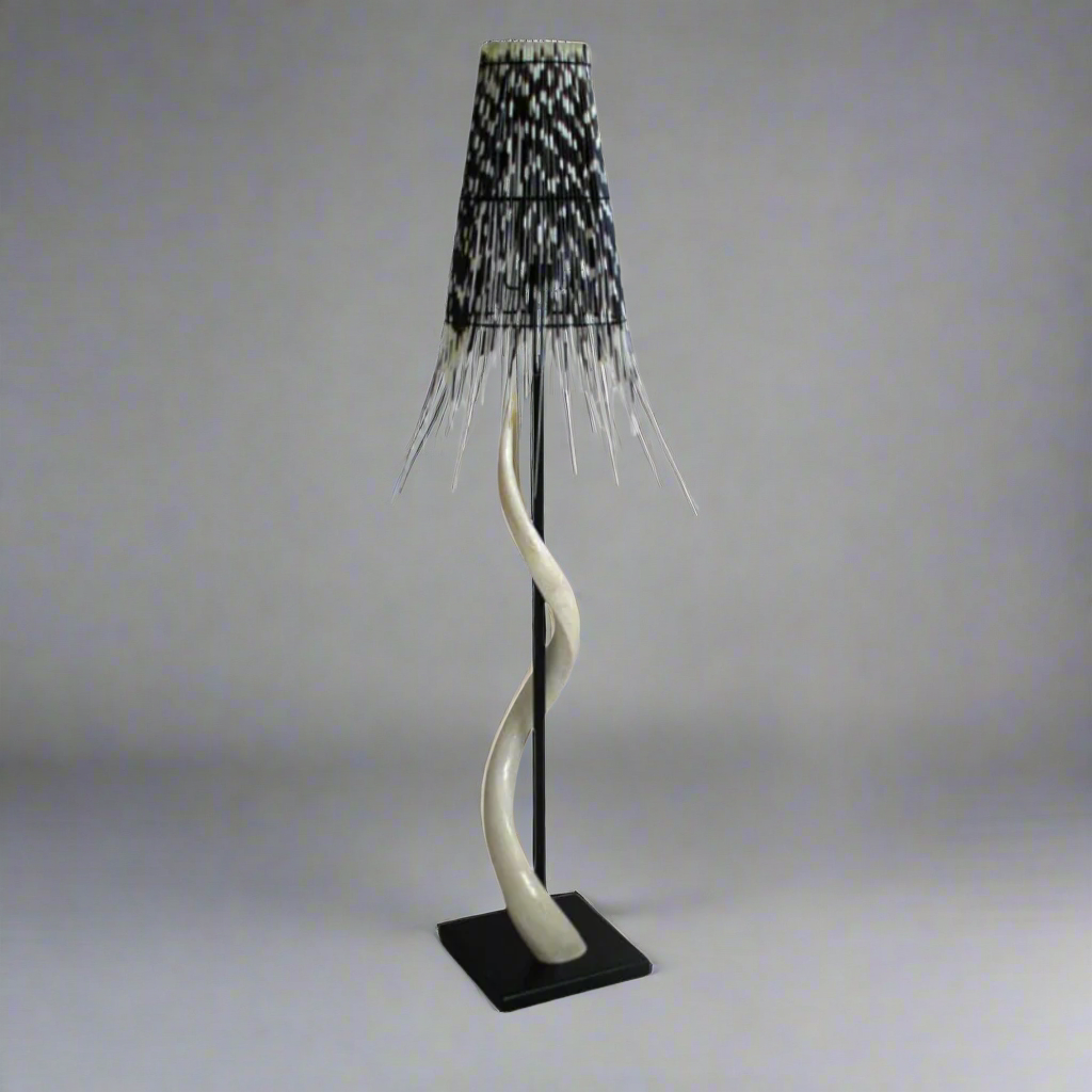 Majestic Black Base Kudu Inner Horn Lamp with Quill Shade
Elevate your space with the striking beauty of African wildlife. This stunning lamp features intricately crafted kudu inner horns set on a sleek black base, paired with a unique cone-shaped quill shade that adds a touch of natural elegance. Unique Boys.