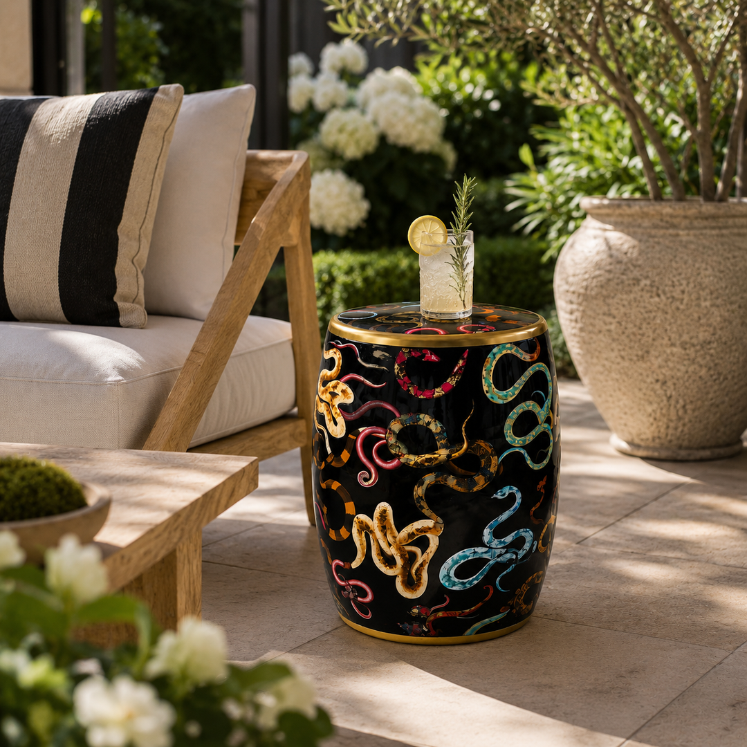 Decorative black glazed ceramic garden stool with colourful snake artwork and gold detailing