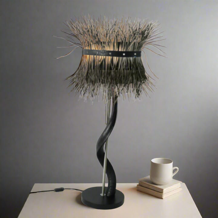Exquisite Black Kudu Horn Lamp with Splitgoose Feather Shade
Bring the majesty of the African savannah into your home with this stunning lamp. Crafted from beautiful black kudu horns and paired with a striking splitgoose feather shade, this piece is a true masterpiece of South African craftsmanship. Unique Boys.