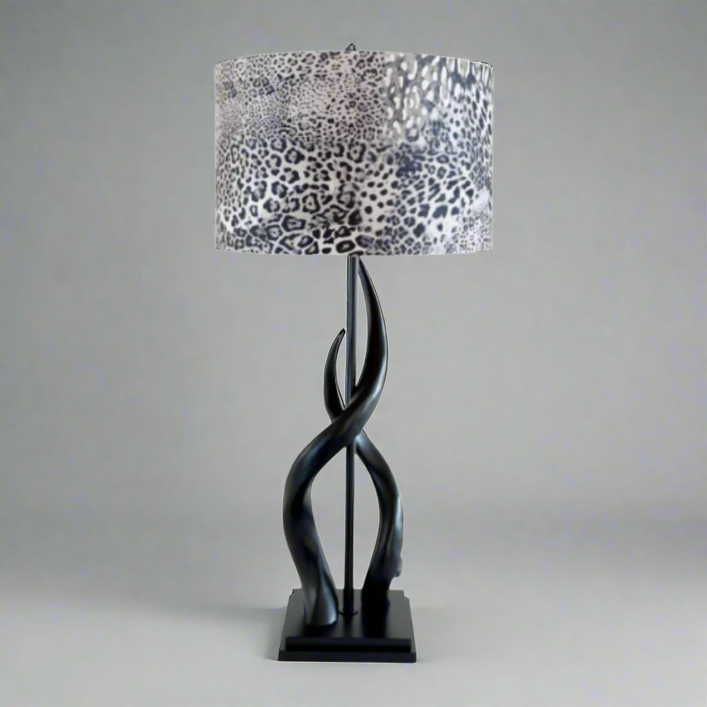 Black Kudu Upright Twist Lamp with Leopard Shade
Bring the wild beauty of Africa into your home with this stunning Black Kudu Upright Twist Lamp, paired with a vibrant leopard shade. Handmade with pride in South Africa by Unique Boys, this lamp showcases exceptional craftsmanship and adds a touch of safari chic to any room. Unique Boys.