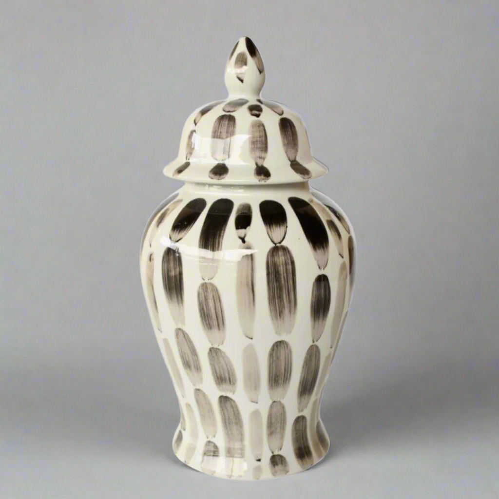 Timeless Elegance: Black Stripe Ginger Jar
Elevate your home decor with the sophisticated Black Stripe Ginger Jar, a beautifully handcrafted piece that combines classic style with modern elegance. Measuring 47x23cm, this stunning jar features a timeless black and white stripe design that adds refinement and visual appeal to any room. Its glossy finish enhances the overall look, making it a beautiful addition to your space. Unique Boys.
