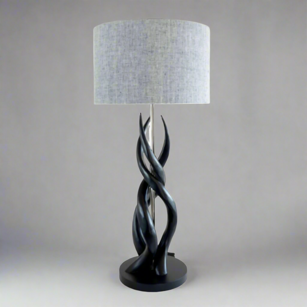 Majestic Black Triple Kudu Upright Twist Lamp with Two-tone Linen Shade
Elevate your space with the striking Black Triple Kudu Upright Twist Lamp, paired with a sophisticated two-tone linen shade. Handmade with pride in South Africa, this unique lamp showcases exceptional craftsmanship and adds a touch of African elegance to any room. Unique Boys.