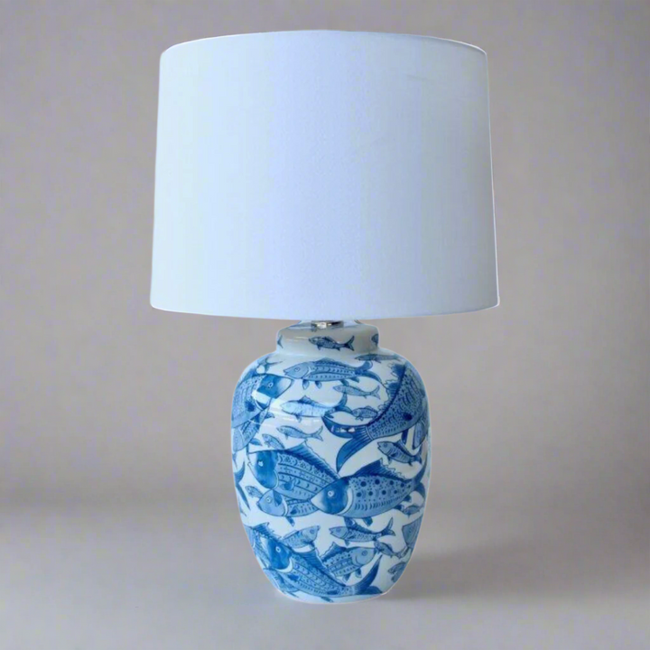 Unique Boys Blue & White Fish Lamp Base
Add a touch of oceanic whimsy to your space with our stunning Blue & White Fish Lamp Base from Unique Boys. Expertly handcrafted to perfection, this lamp features a playful fish design that sparks joy and catches the eye. Paired with an elegant off-white shade, this lamp base creates a harmonious balance that adds to the overall aesthetic of your room.www.unique boys.co.za