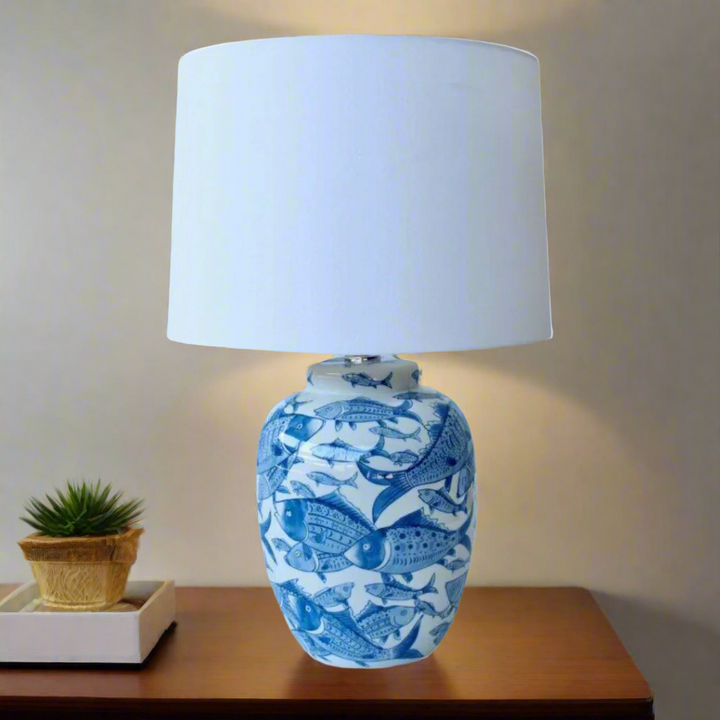 Unique Boys Blue & White Fish Lamp Base
Add a touch of oceanic whimsy to your space with our stunning Blue & White Fish Lamp Base from Unique Boys. Expertly handcrafted to perfection, this lamp features a playful fish design that sparks joy and catches the eye. Paired with an elegant off-white shade, this lamp base creates a harmonious balance that adds to the overall aesthetic of your roomwww.unique boys.co.za