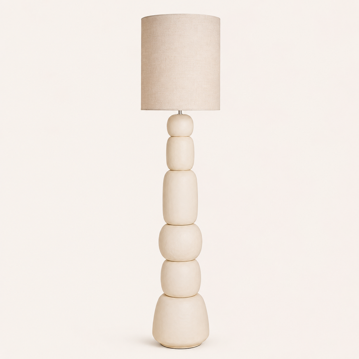 Add organic elegance with the Boulders Floor Lamp, featuring a distinctive sculptural base and neutral fabric shade.