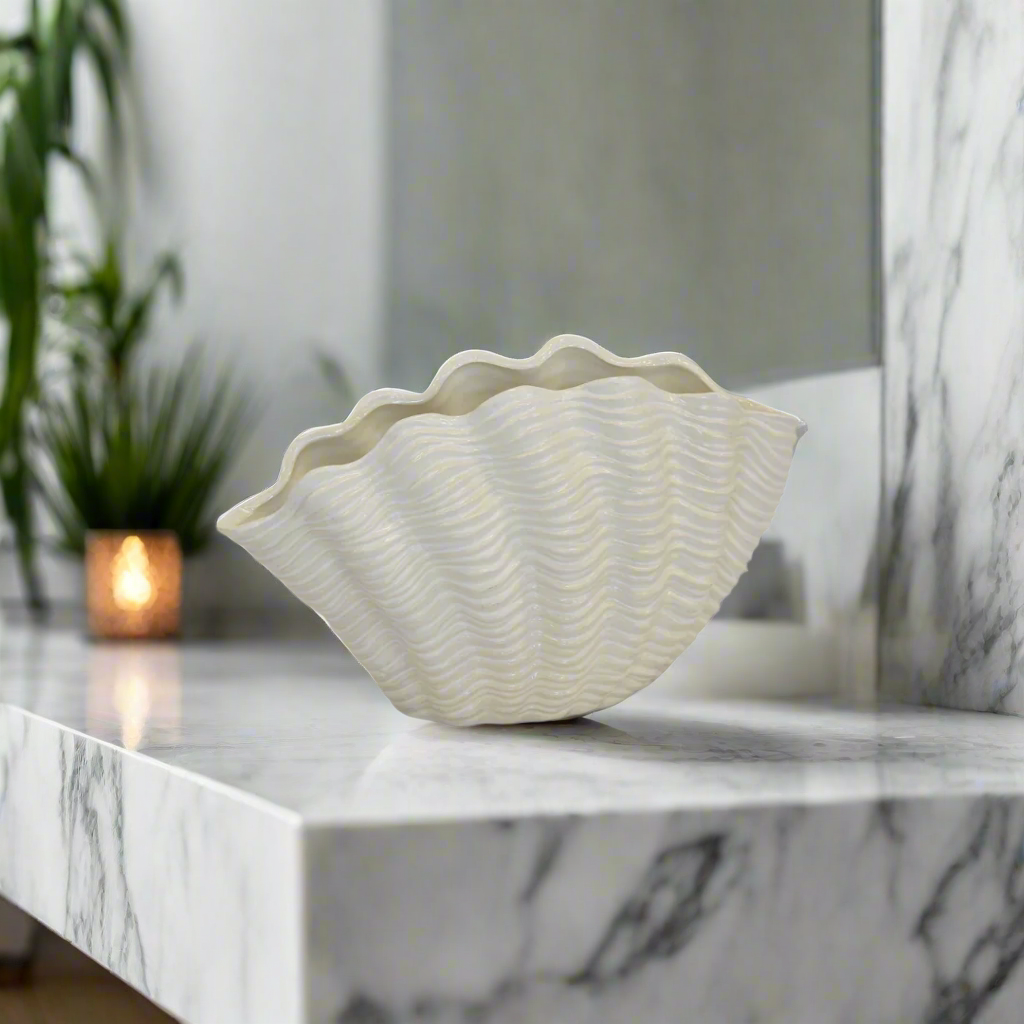 Ceramic Adora Clam Shell Vase
Bring a touch of coastal charm and whimsy to your space with the vibrant Ceramic Adora Clam Shell Vase, a unique and stylish decorative piece. www.uniqueboys.co.za