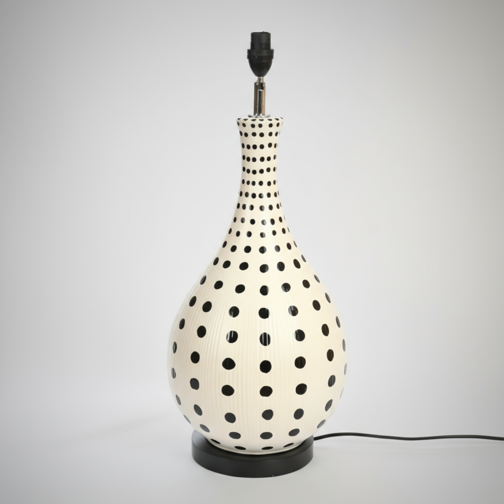 Ceramic Lamp Black &amp; Cream Dotty &nbsp;22 X 60 CM
Add a touch of coastal charm to your space with our stunning Ceramic Lamp Black &amp; Cream Dotty &nbsp;22 X 60 CM. This unique lamp features a soothing dotted base creating a natural and earthy ambiance perfect for relaxing or entertaining. Measuring 60 cm in height and 22cm in width, this lamp is perfectly sized for living rooms, bedrooms, or offices. Unique Boys.