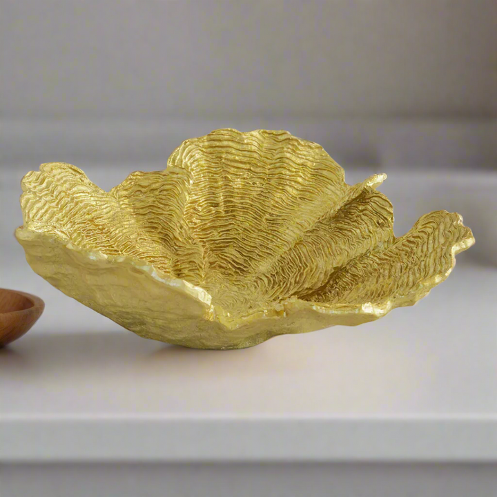 Coral Flower Plate Gold
Elevate your interior decor with the stunning Coral Flower Plate Gold, a masterpiece of elegant design.
Product Features:
Exquisite gold finish adds a touch of luxury and sophistication
Intricate coral flower pattern creates a unique, eye-catching aesthetic
Perfect for enhancing any room's ambiance and style
Styling Ideas:
Display as a decorative centerpiece on a coffee table or console table
Use as a beautiful wall decor piece
Pair with complementary gold accents for a cohesive look