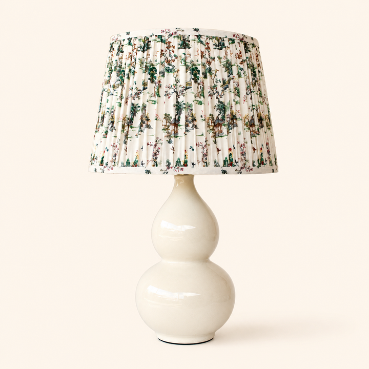 Cream Bulbous Lamp with Toile Shade 65x38cm, combining graceful curves with beautiful scenic detailing.