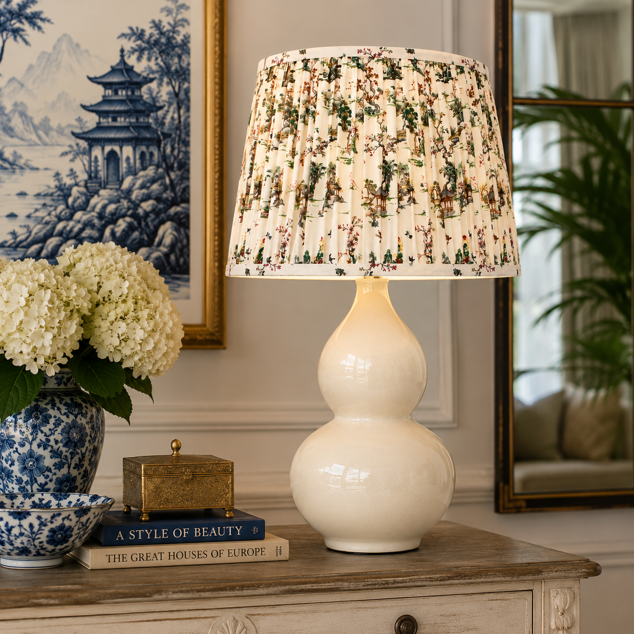 Elegant Cream Ceramic Lamp with a charming toile shade, perfect for adding classic style and warmth to your home.