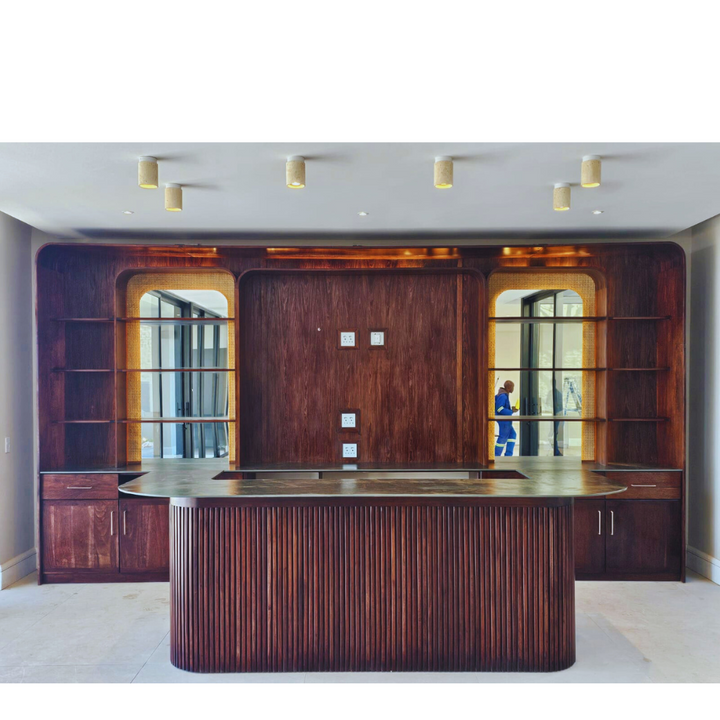Custom Made Slatted Kiaat Bar
Elevate your entertaining space with our bespoke Slatted Kiaat Bar, crafted to your exact specifications. This stunning bar features a unique slatted design, showcasing the natural beauty of Kiaat wood. Unique Boys.
