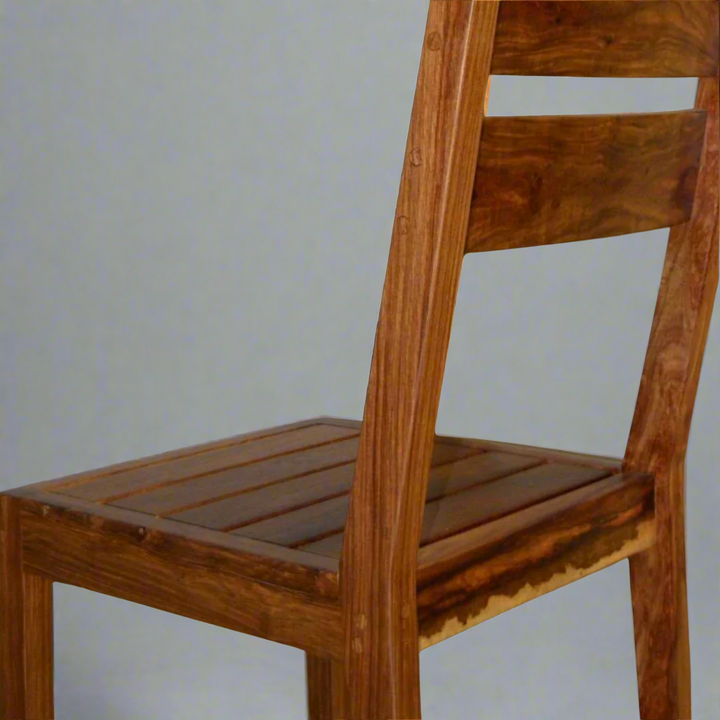 Deluxe Kiaat Chair: Elegant Simplicity
Experience the beauty of natural wood with the Deluxe Kiaat Chair. This stylish chair features a wooden seat and a sturdy design, perfect for adding a touch of elegance to any room.