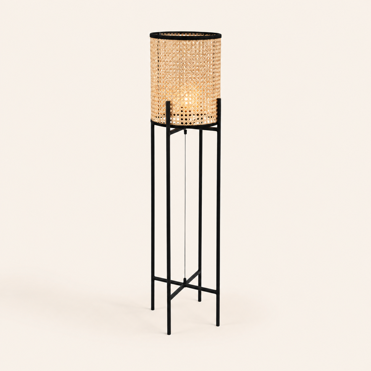 Dutch Pedestal Lamp Small with a natural woven shade and sleek black frame for warm, contemporary interiors.