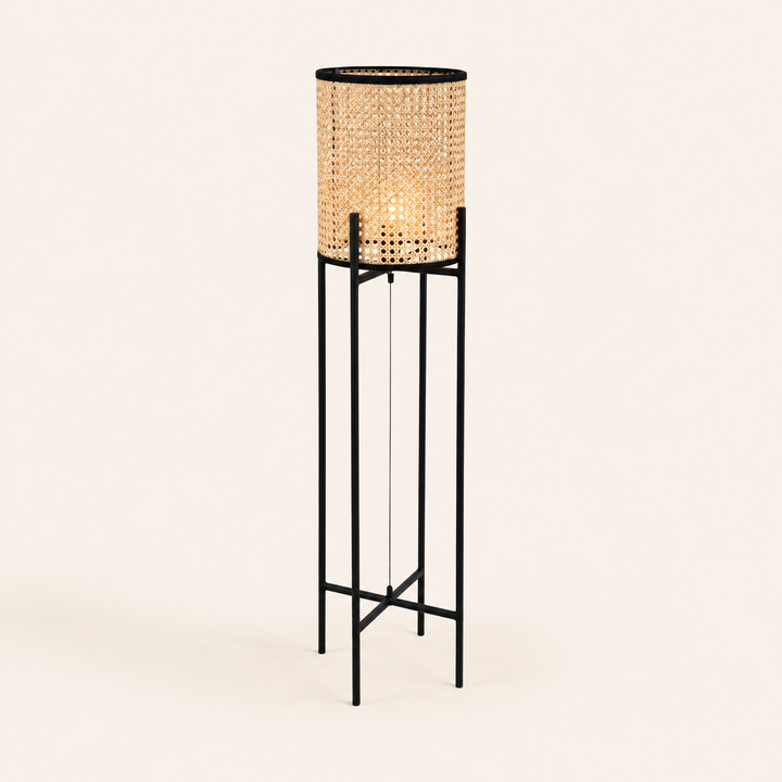 Dutch Pedestal Lamp Small with a natural woven shade and sleek black frame for warm, contemporary interiors.