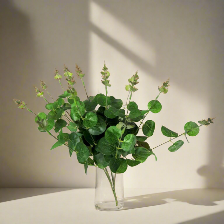 Eucalyptus Magnifica - A Smoky Twist on Timeless Elegance!
Introducing Eucalyptus Magnifica, a stunning artificial plant that adds a touch of greenery with a smoky twist to any space!
50cmL stems, each featuring 4 main branches and 160 leaves, creating a full and lush appearance
Growth tips add an extra dimension, making this plant a unique and elegant addition
Artificial plants are low maintenance, no watering or pruning required