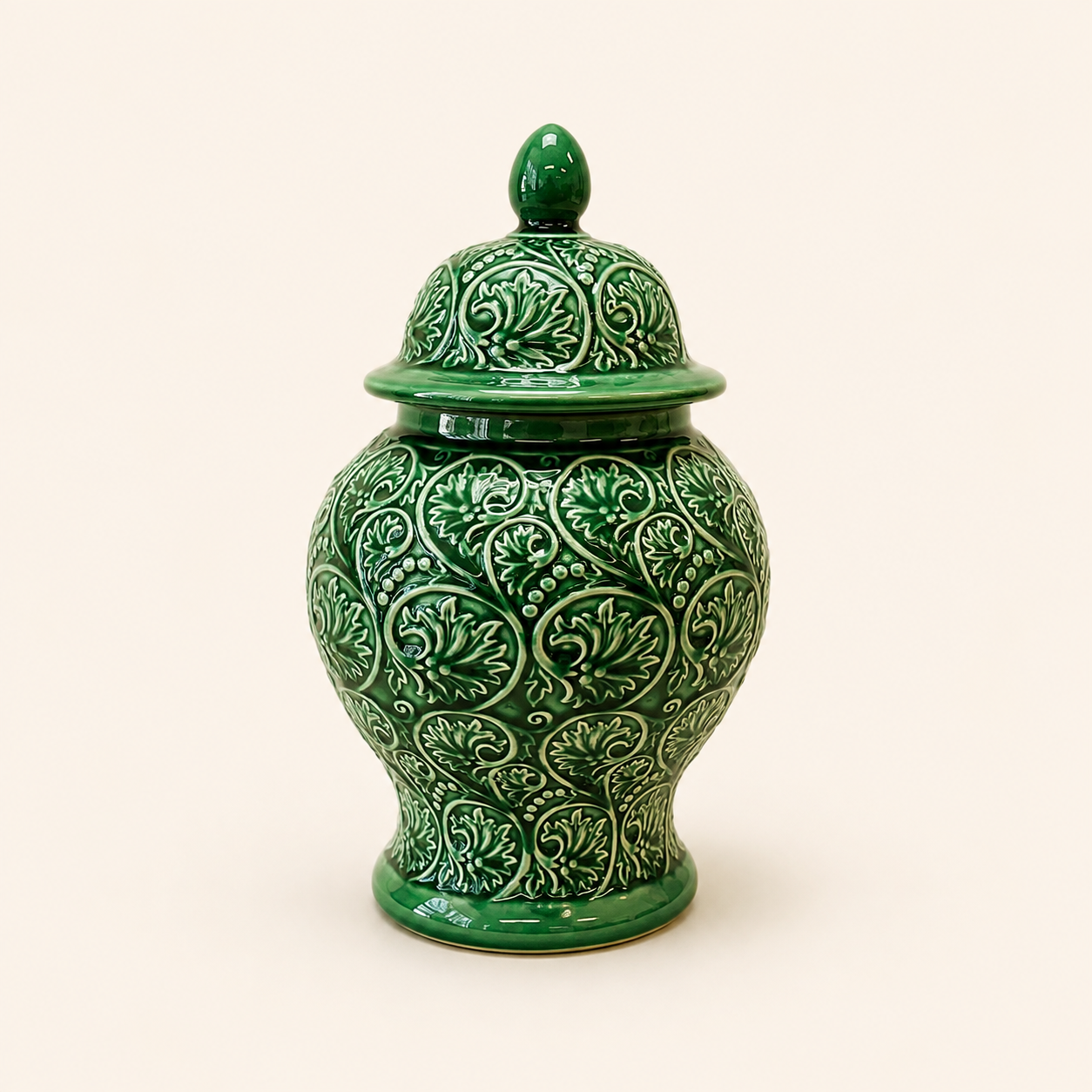 Evergreen Ginger Jar in glossy green ceramic with embossed scroll detailing and decorative lid.