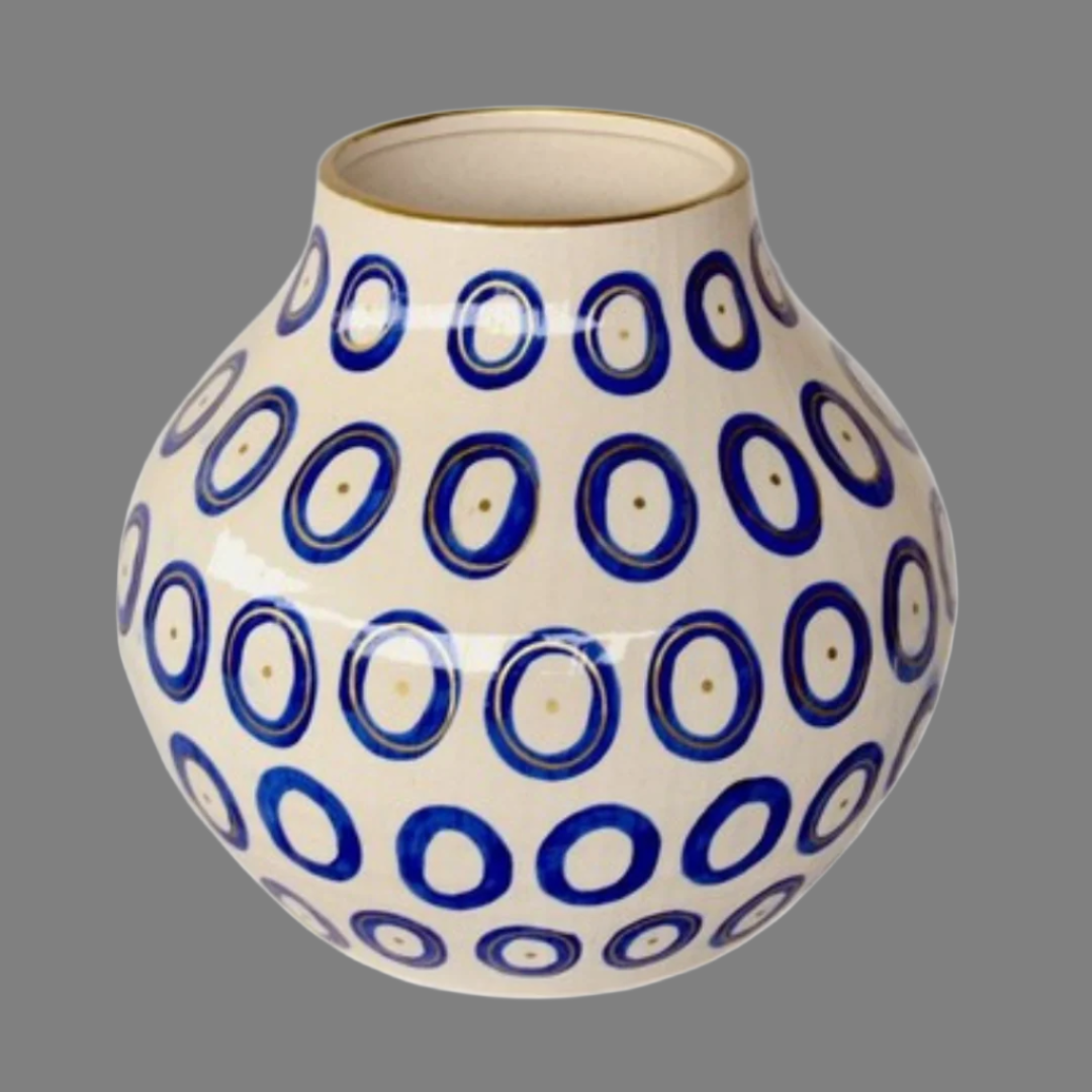 Extra Large Blue Circle Ceramic Vase Gold Trim 37X34cm
Elevate your home decor with our stunning Extra Large Blue Circle Ceramic Vase Gold Trim 37X34cm. Handcrafted with precision and care, this unique vase features a beautiful design that adds a touch of elegance to any room. Its striking is sure to become a focal point in your space, and its large size makes it perfect for showcasing your favorite flowers or branches. Unique Boys.
