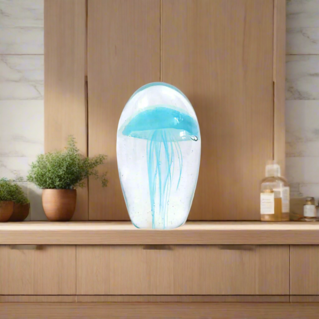 Monaluna 12cm: An Oceanic Masterpiece in Glass
Dive into the depths of elegance with the Monaluna 12cm, a breathtakingly beautiful solid glass dome. Expertly handcrafted, this stunning piece measures 12cm in height and 22.5cm in circumference, inviting you to gaze into its mesmerizing clear depths.