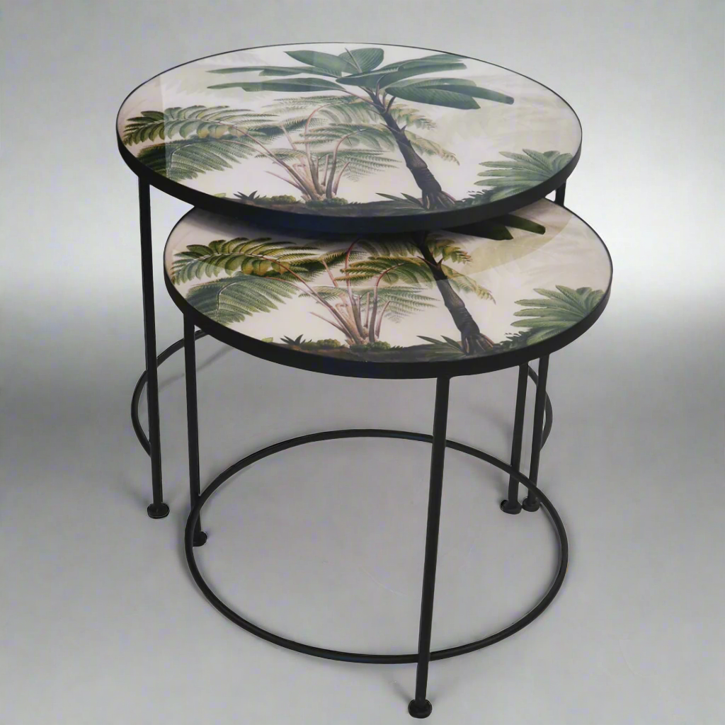 Glass Nesting Palm Tree Tables - Set of 2
Elevate your living room decor with the exquisite Glass Nesting Palm Tree Tables, expertly crafted to add a touch of tropical elegance and sophistication to any interior setting.
Design Features:
Set of 2 tables:
Large: 70cm (Diameter) x 62cm (Height)
Small: 62cm (Diameter) x 58cm (Height)
Made from high-quality glass with a beautiful palm tree-inspired design
Nesting design allows for versatile use and easy storage
Perfect for hosting and entertaining
