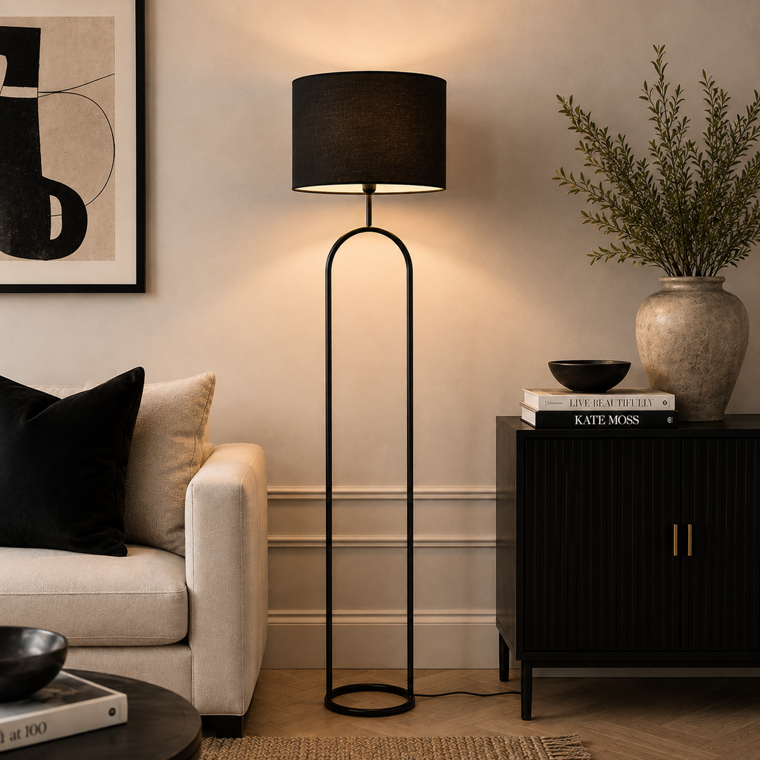 Add contemporary style with the Halo Floor Lamp, featuring a striking black arched frame and minimalist design.