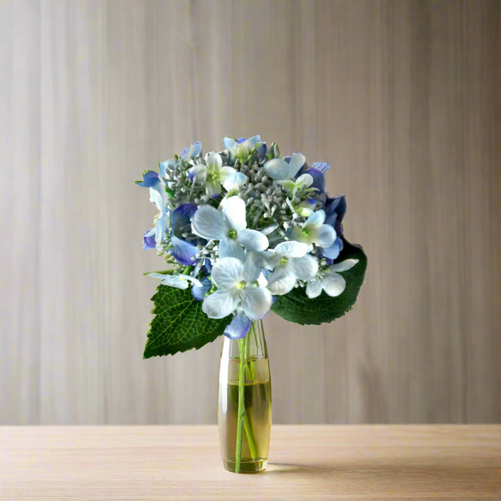 Hydrangea Bridal Blue by Unique Boys.
Add a touch of elegance to your bridal work with our exquisite Hydrangea Bridal Blue artificial flowers, expertly crafted for a flawless look.
Breathtaking Details