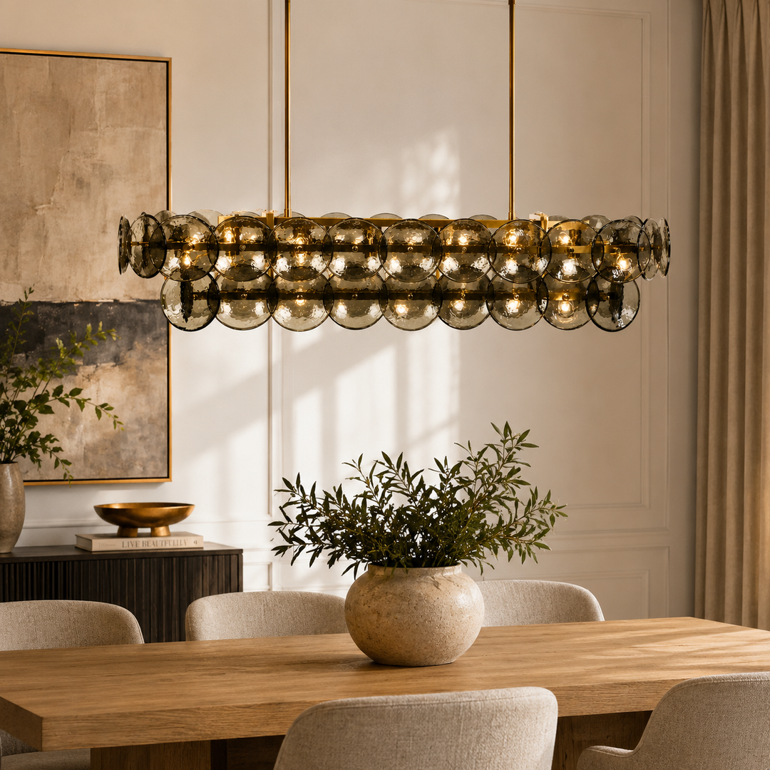 Elevate your space with the Izara Glass &amp; Brass Chandelier, a striking 1000mm statement light.