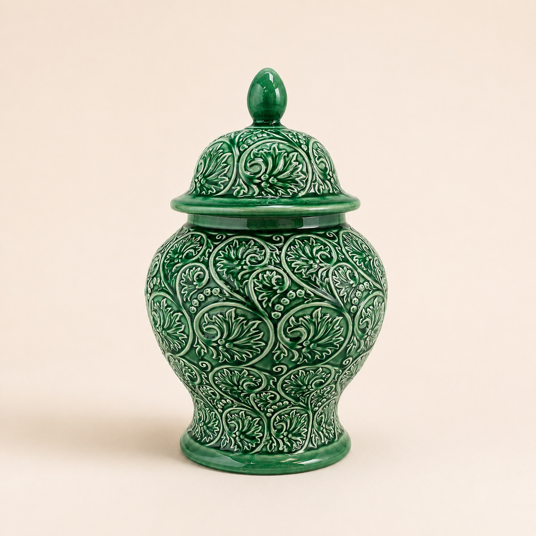 Jade Scroll Ginger Jar in glossy green ceramic with embossed scroll pattern and decorative lid.