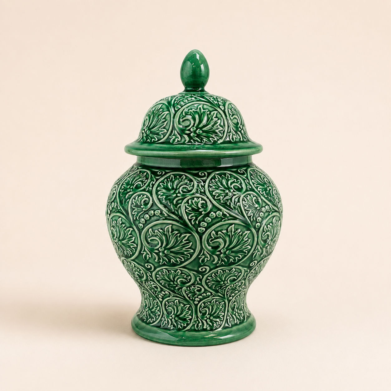 Jade Scroll Ginger Jar in glossy green ceramic with embossed scroll pattern and decorative lid.