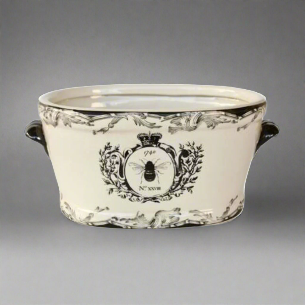 Large Black &amp; White Bee Planter
Elevate your space with a touch of whimsy and sophistication! Our Large Black &amp; White Bee Planter is a stylish ceramic masterpiece featuring a vibrant bee motif that's sure to captivate anyone's attention. Whether you're looking to add a decorative piece to your indoor space or a charming accent to your outdoor garden, this beautiful planter is the perfect choice. Unique Boys.